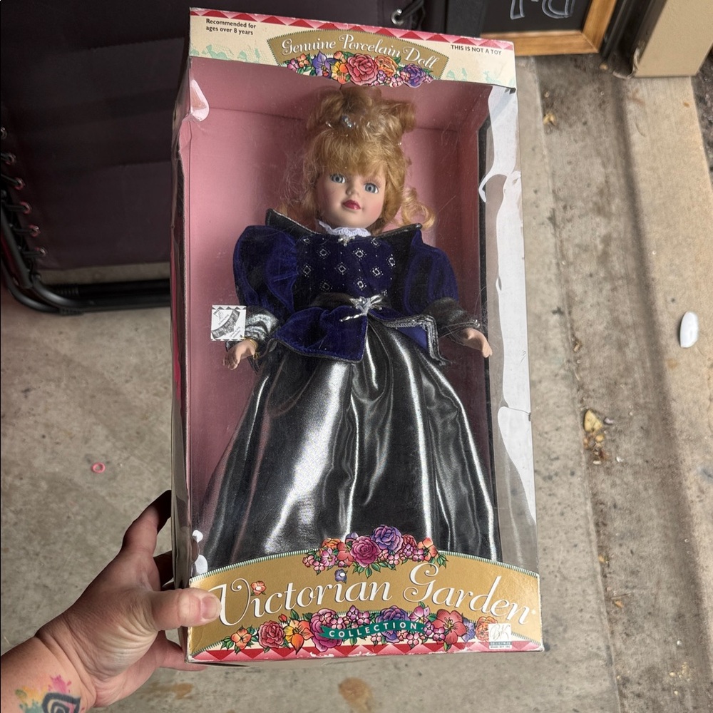 Porcelain Doll with Blue and Silver Dress